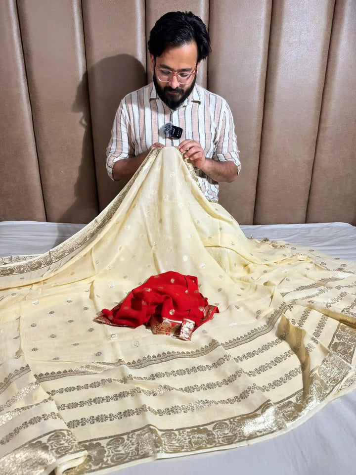 Banarasi georgette silk saree with contarst rich blouse and tassel pallu