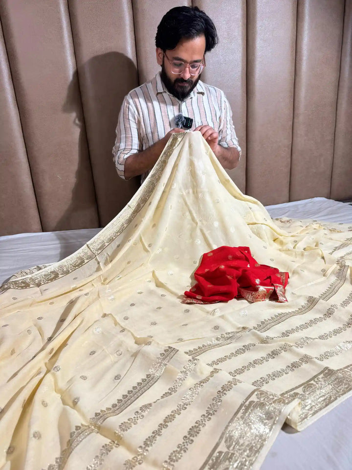 Banarasi georgette silk saree with contarst rich blouse and tassel pallu