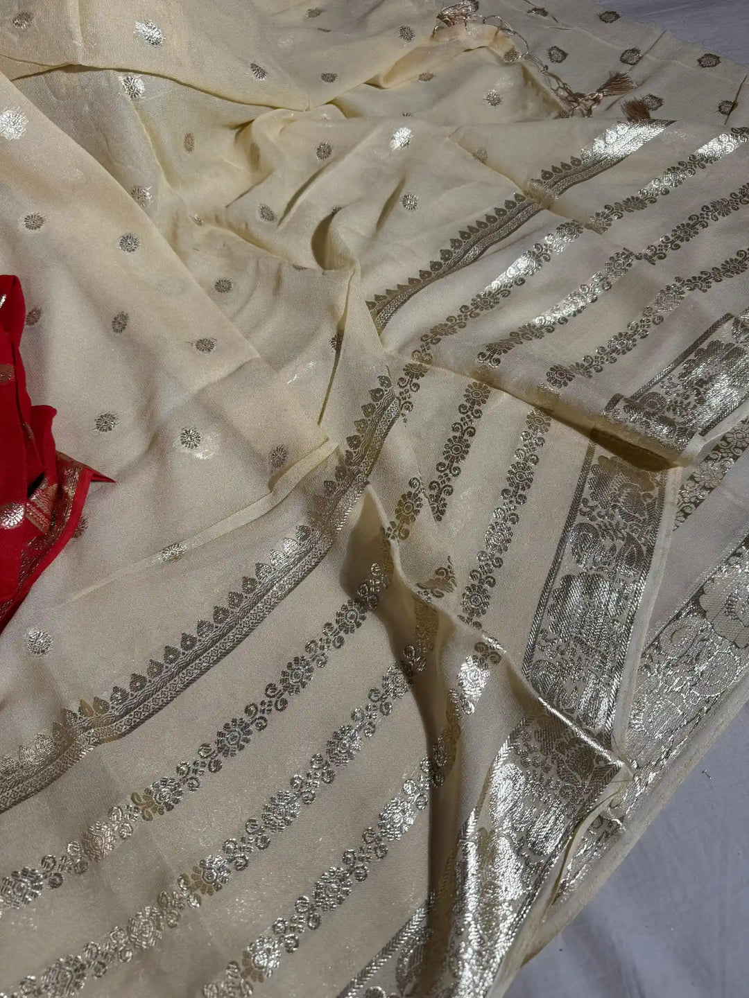 Banarasi georgette silk saree with contarst rich blouse and tassel pallu