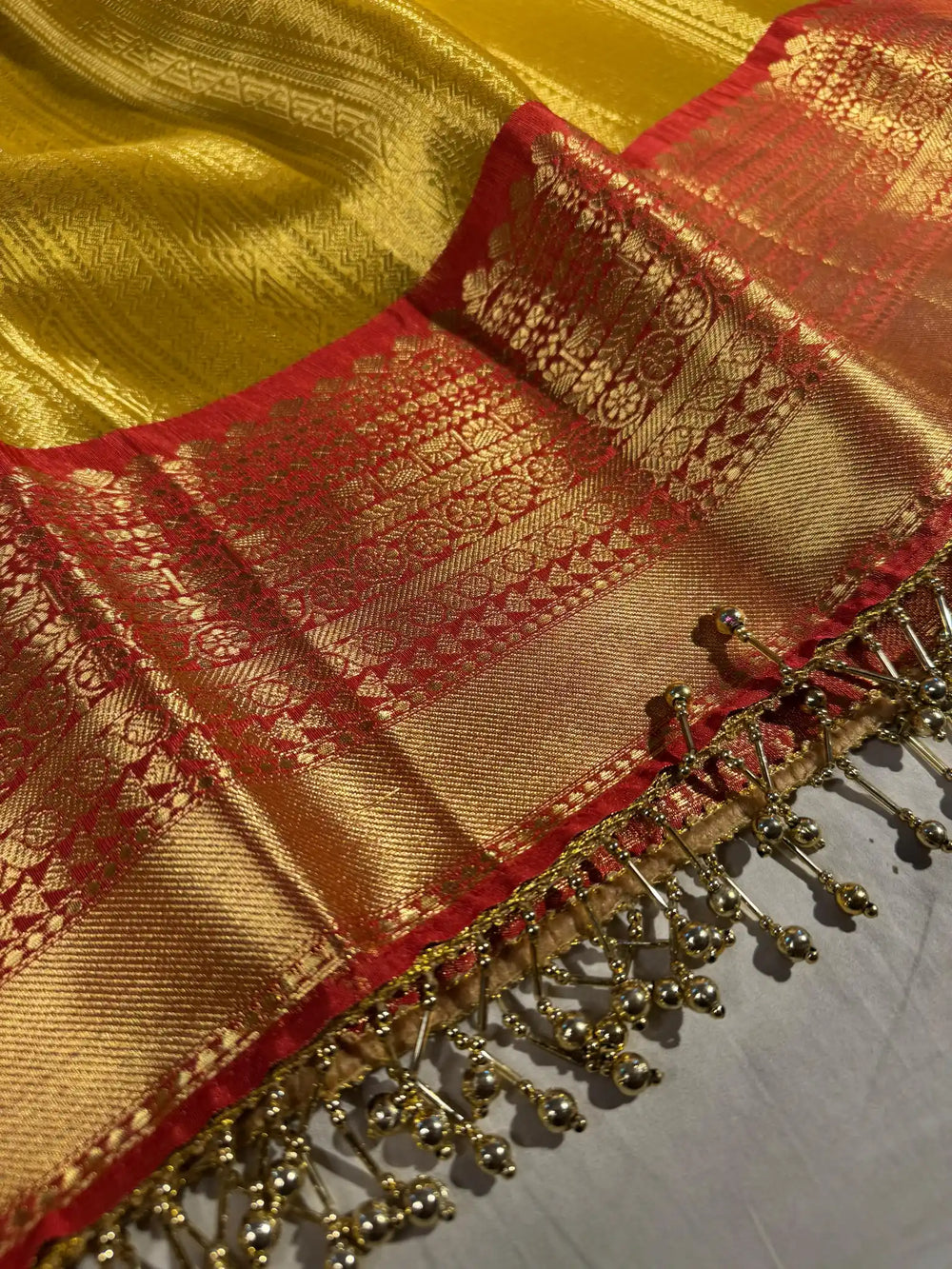 Golden Nita Ambani Mam inspired tissue silk saree with heavy jarkan lace work