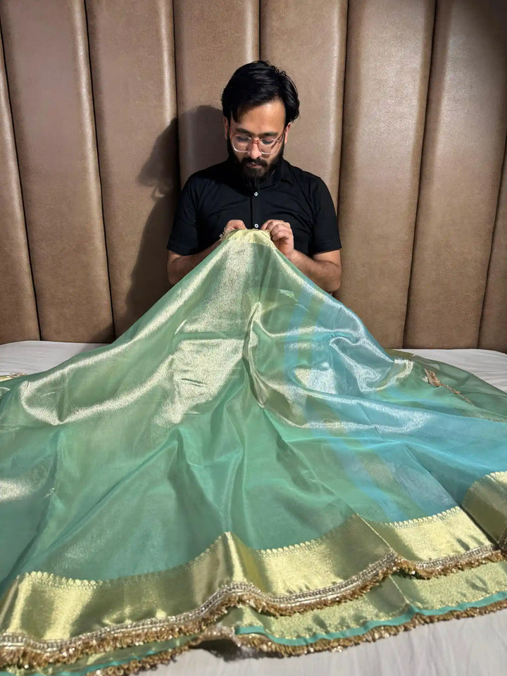 Light seasgreen tissue silk saree with lace work
