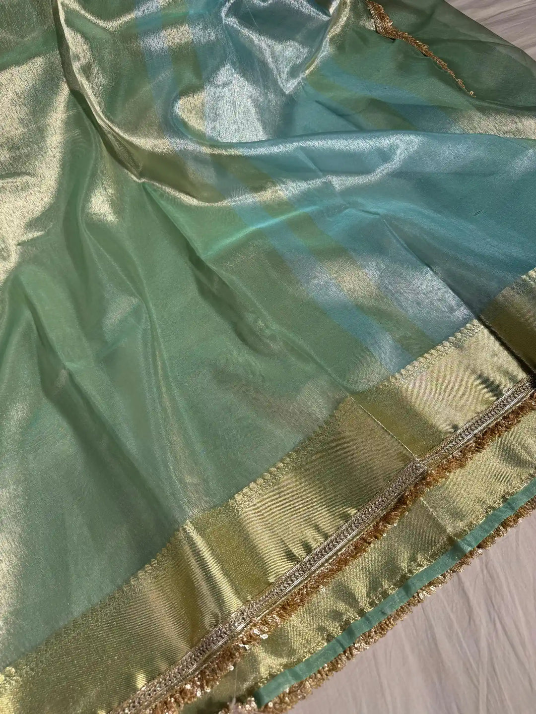 Light seasgreen tissue silk saree with lace work