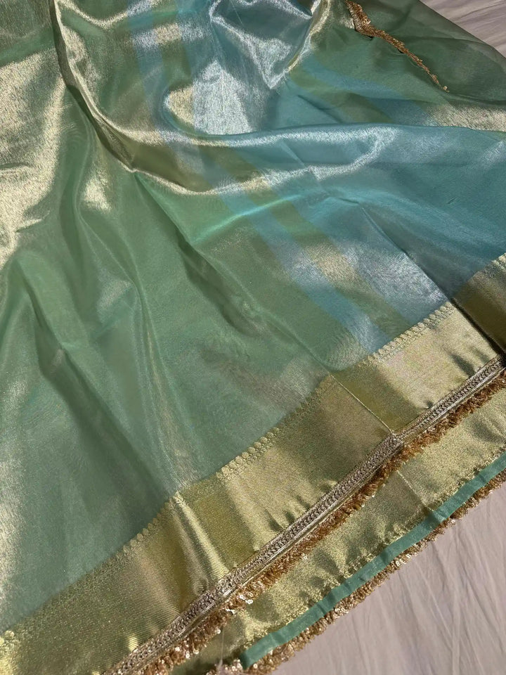 Light seasgreen tissue silk saree with lace work