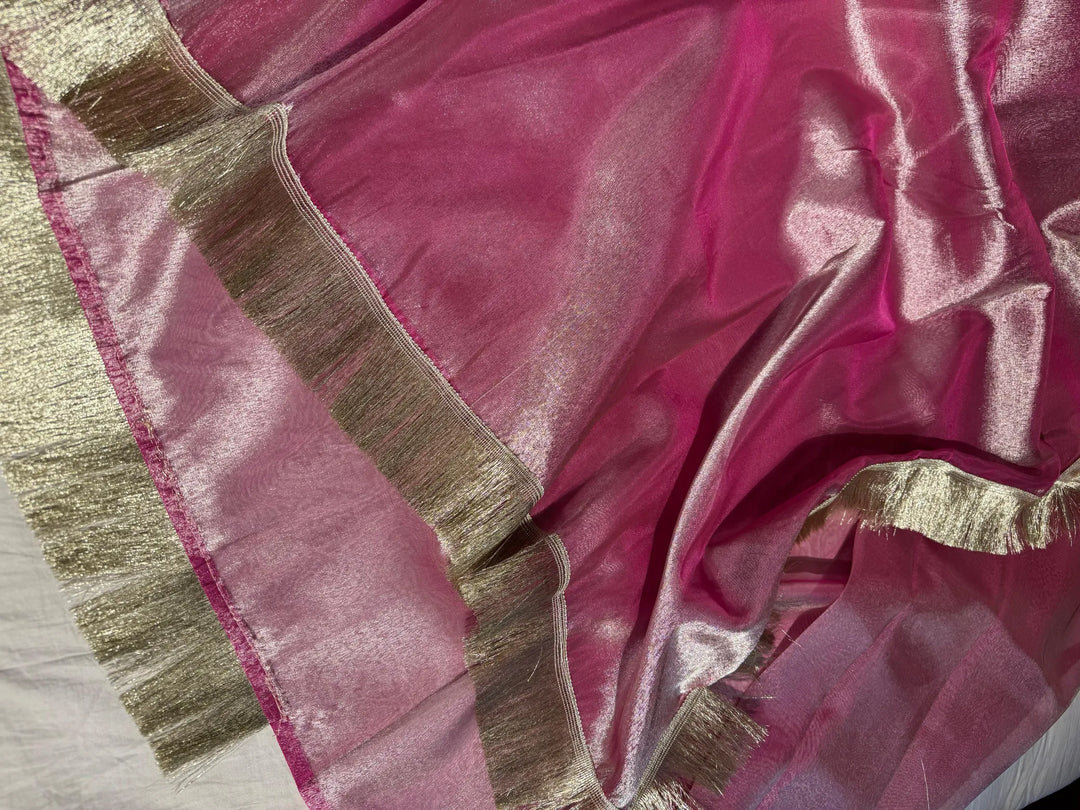 Premium rani pink tissue silk saree with lacework
