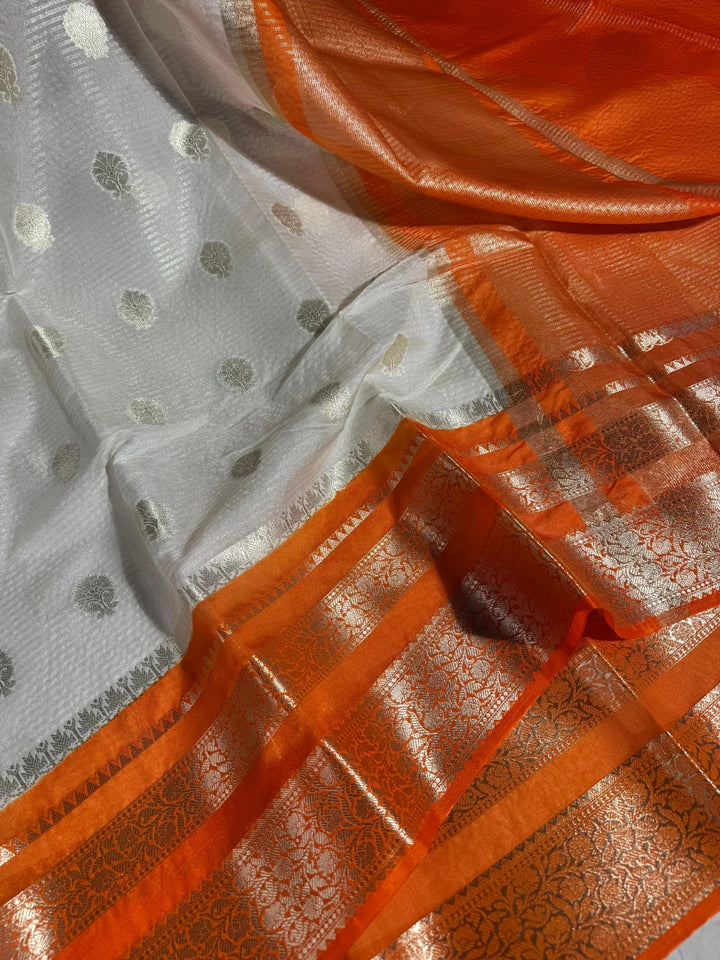 summer friendly cream with contrast rich border and pallu