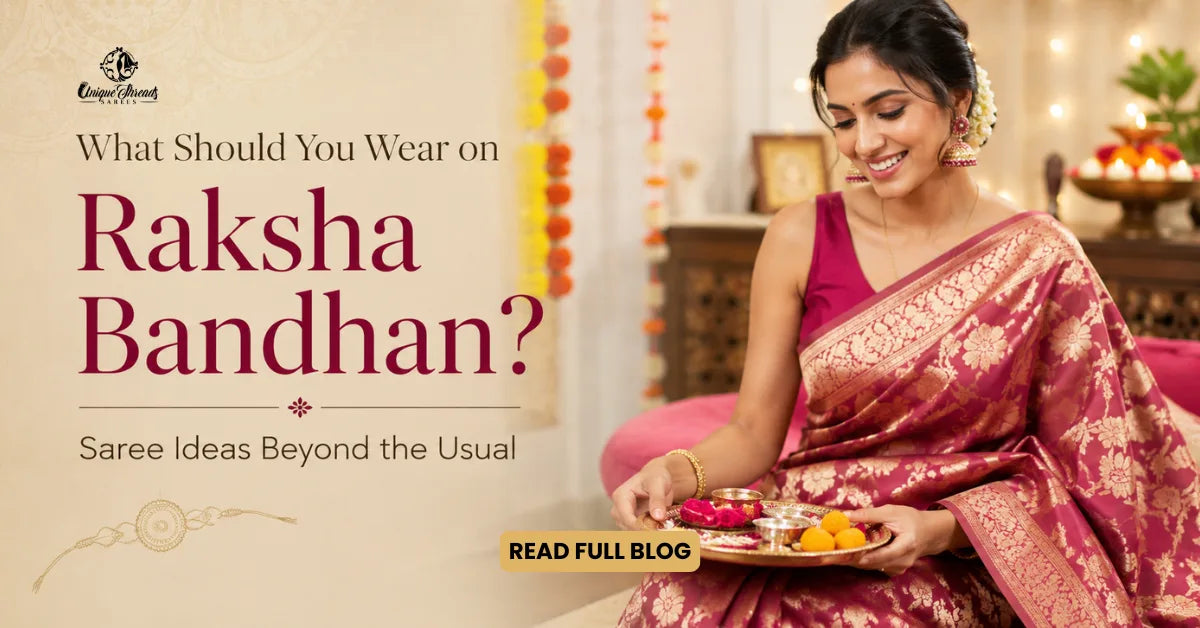 Woman wearing a pink Banarasi silk saree holding a festive thali for Raksha Bandhan.