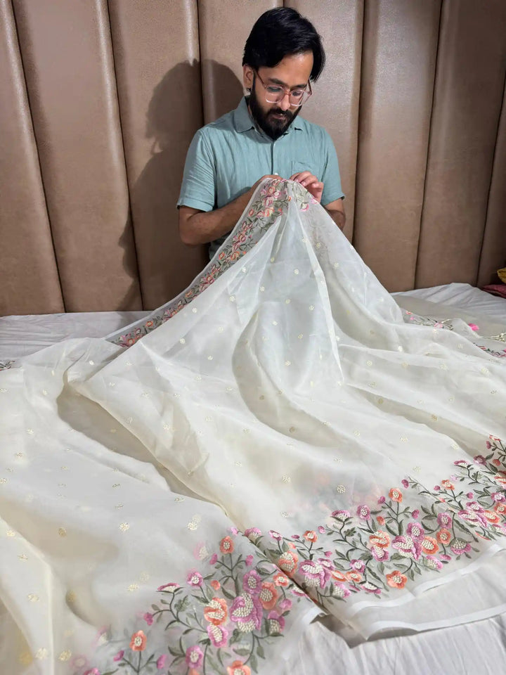 Banarasi organza silk with NoorTaar technique border and pallu work with premium tassels