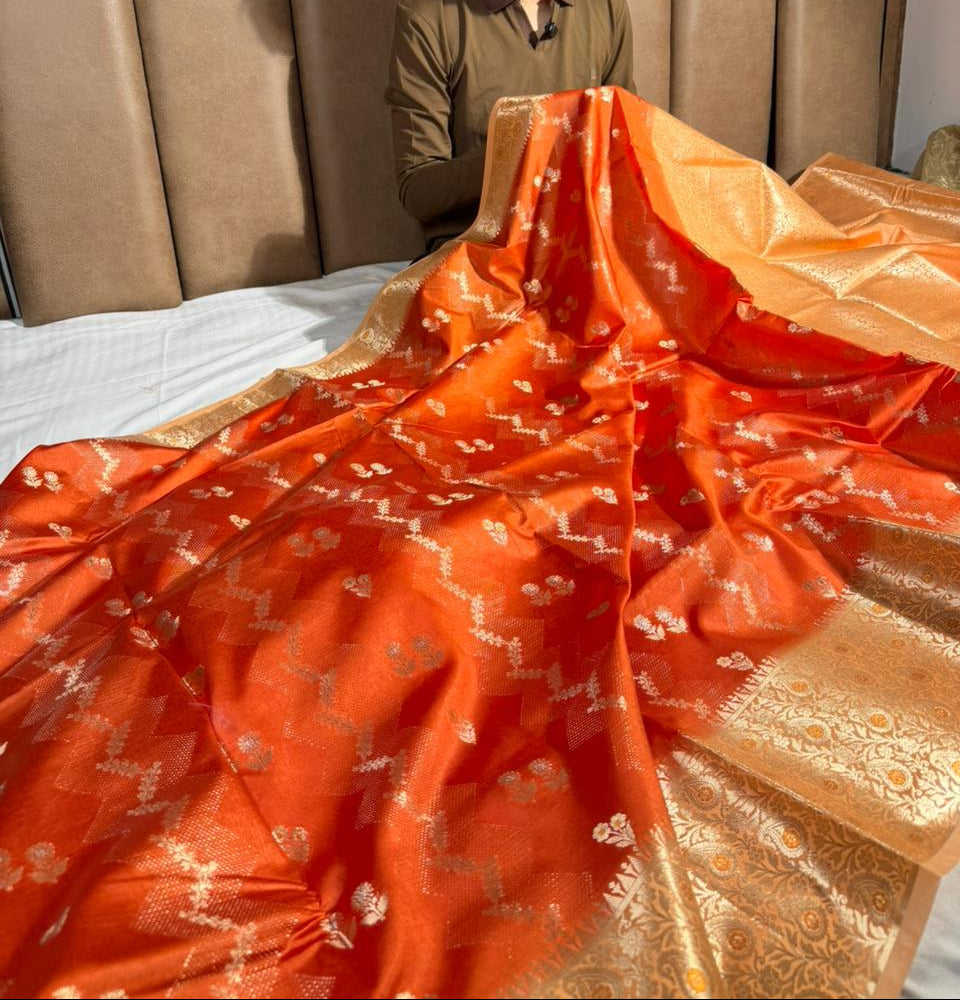 Bright orange intricate weave raw dupion silk saree