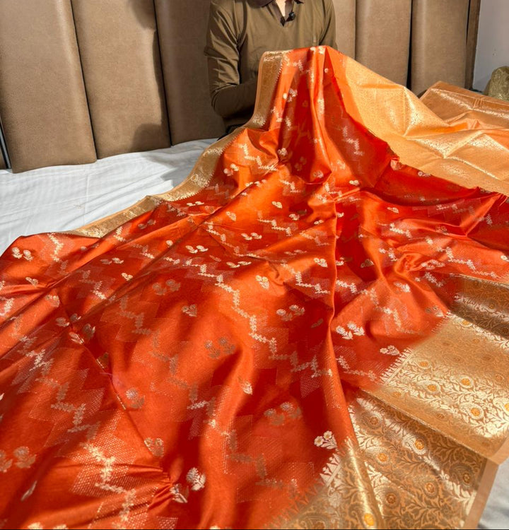 Bright orange intricate weave raw dupion silk saree