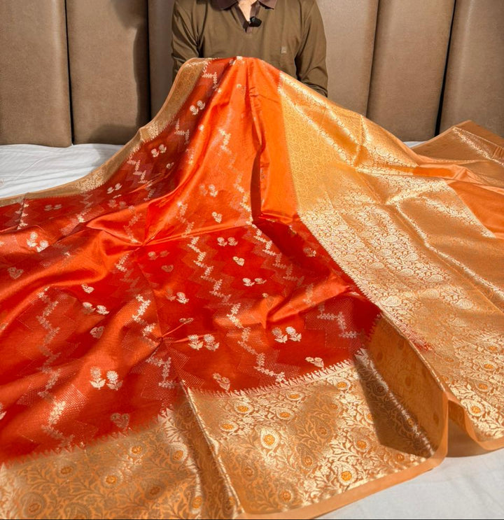 Bright orange intricate weave raw dupion silk saree
