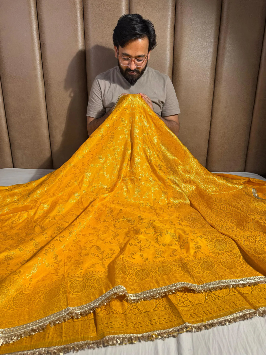 Bright yellow banarasi georgette silk saree with silver meena & lace work