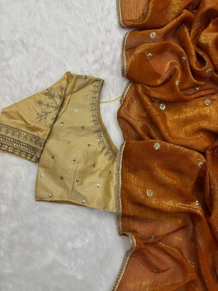 Exclusive Dark Orangish Shade Shimmery Tissue Silk Saree