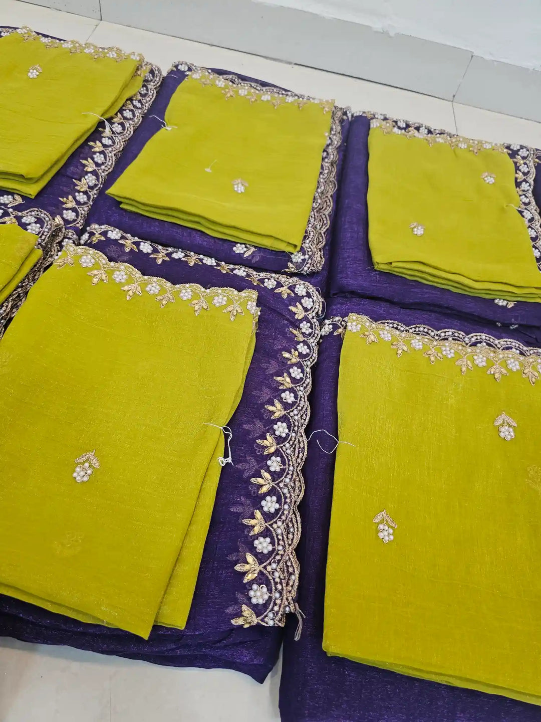 Handwork Purple shade shimmery tissue saree with lemon blouse