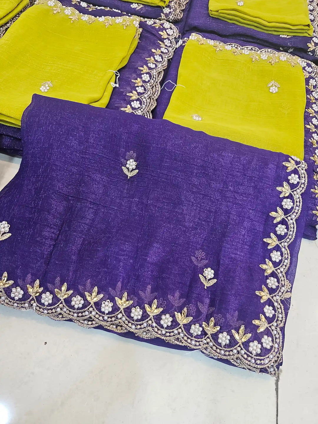 Handwork Purple shade shimmery tissue saree with lemon blouse