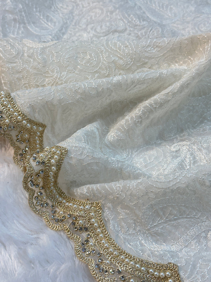Pure Mul Cotton chikankari saree with motiwork lace border and scelup pallu