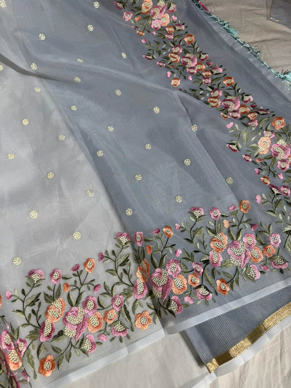 Light Gray Banarasi organza silk with NoorTaar technique border and pallu work with premium tassels 