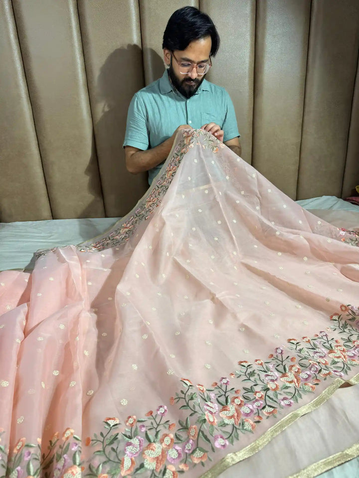 Light Peach Banarasi organza silk with NoorTaar technique border and pallu work with premium tassels