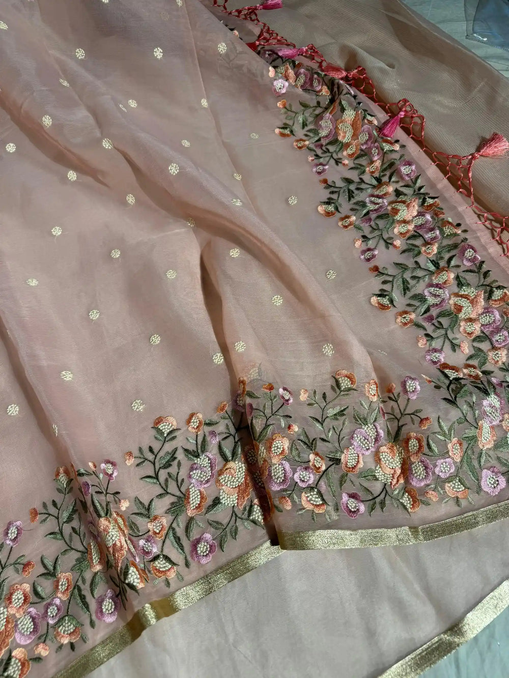 Light Peach Banarasi organza silk with NoorTaar technique border and pallu work with premium tassels
