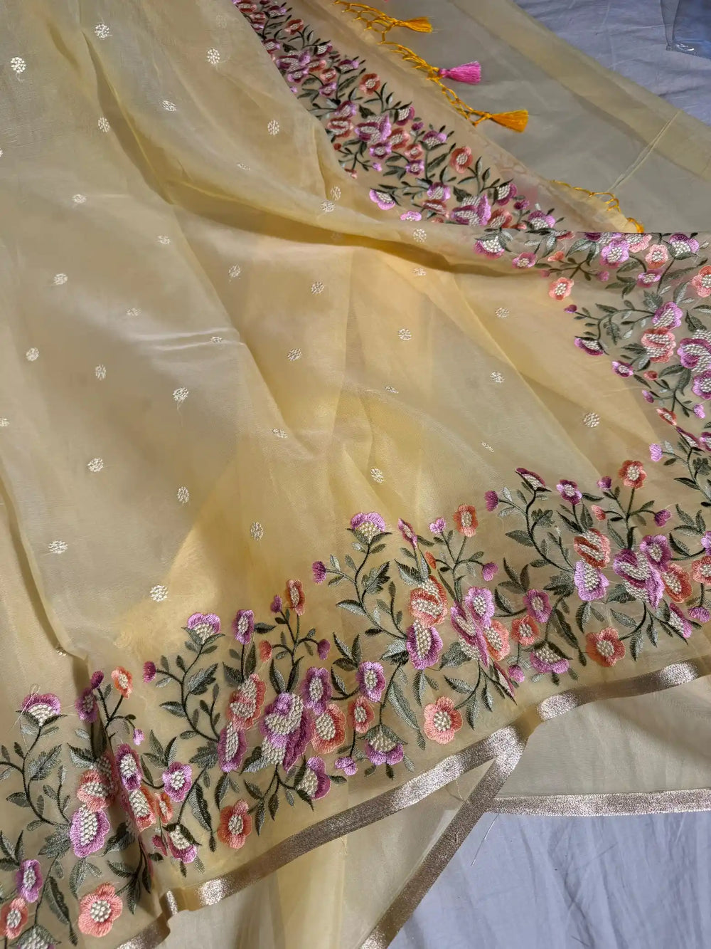 Light Yellow Banarasi organza silk with NoorTaar technique border and pallu work with premium tassels