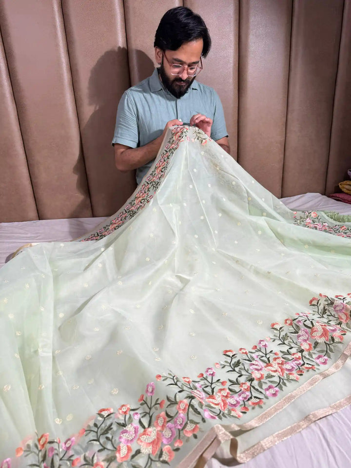 Mint Green Banarasi organza silk with NoorTaar technique border and pallu work with premium tassels