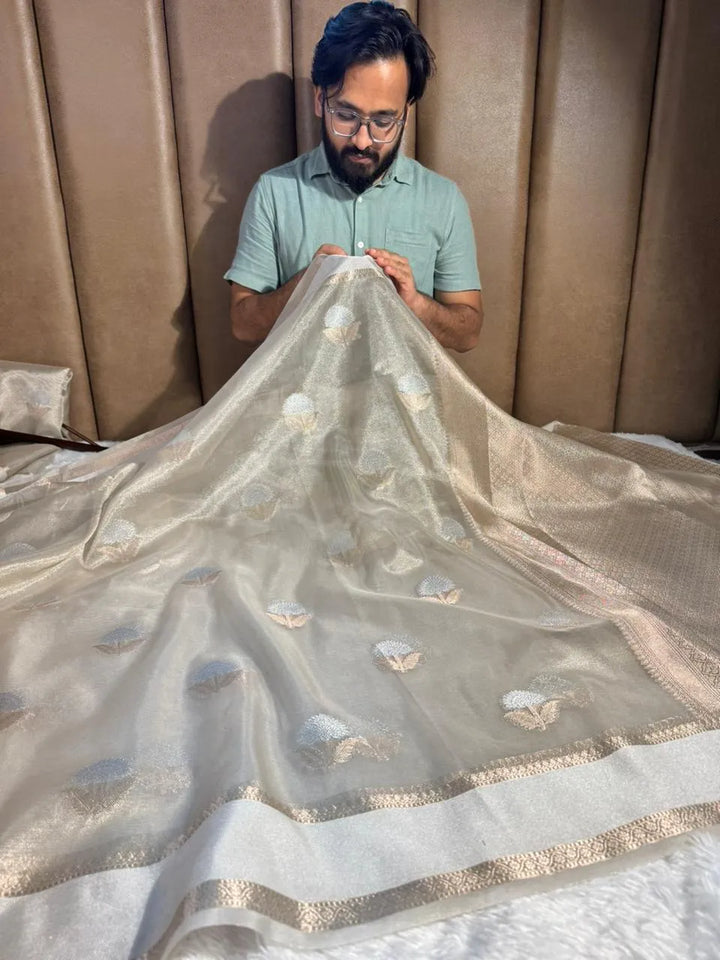 Pearl white tissue silk saree with rich pallu and blouse
