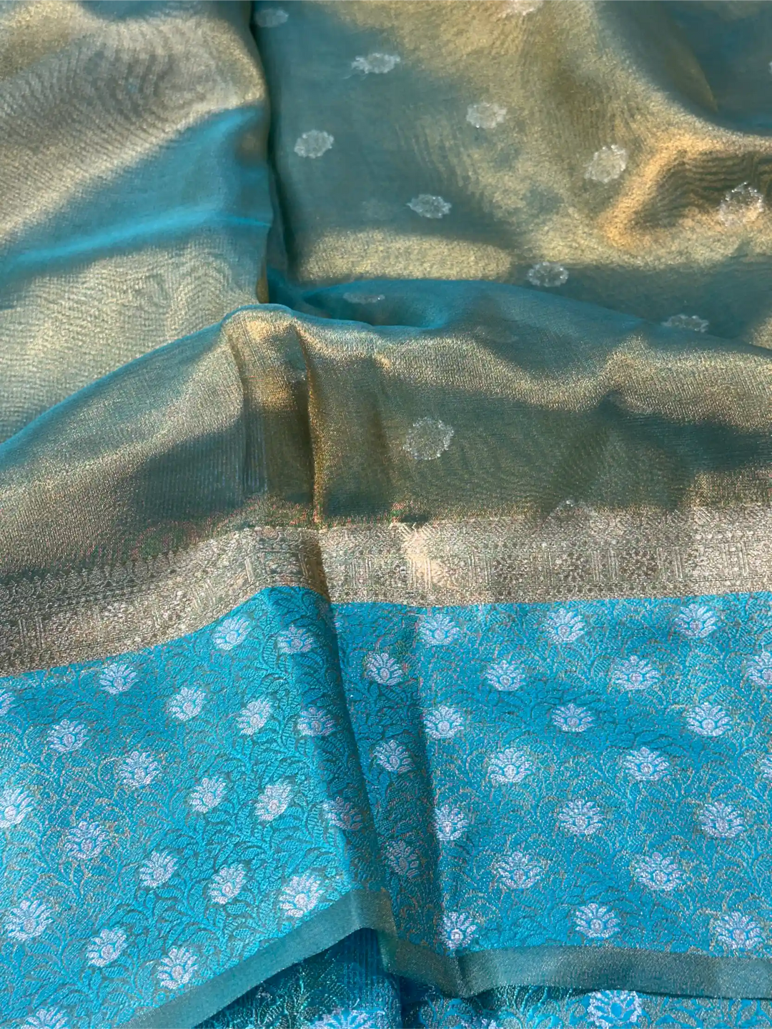 Close-up of a fabric with blue and green patterns