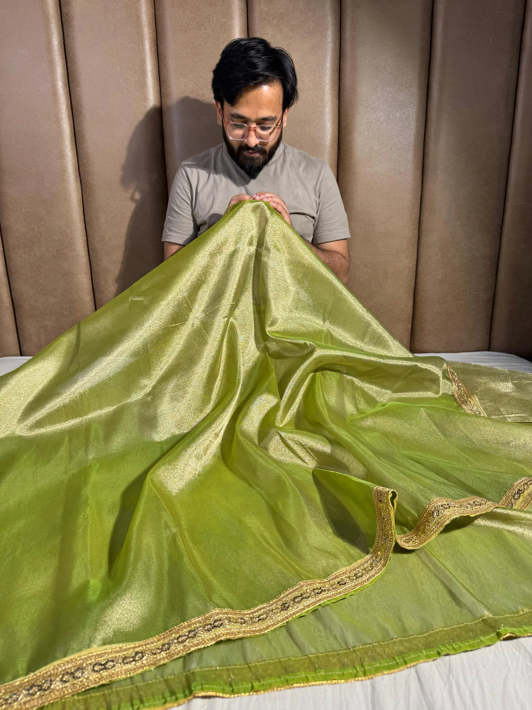 Premium green shade tissue silk saree with lacework