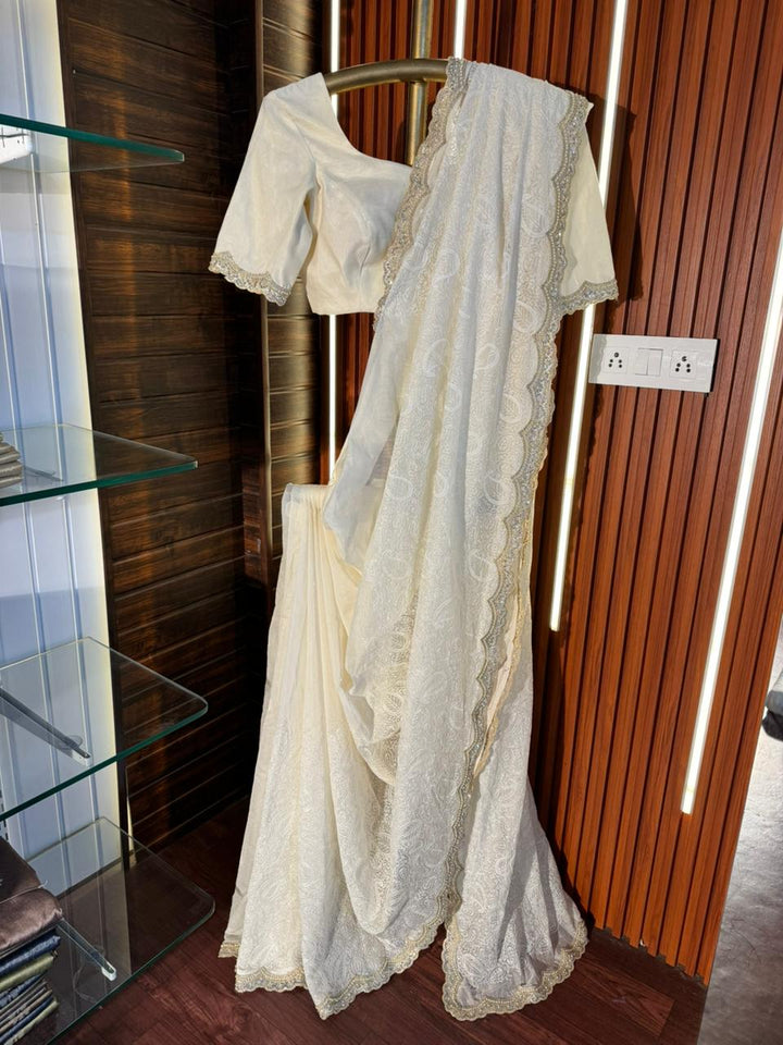 Pure Mul Cotton chikankari saree with motiwork lace border and scelup pallu