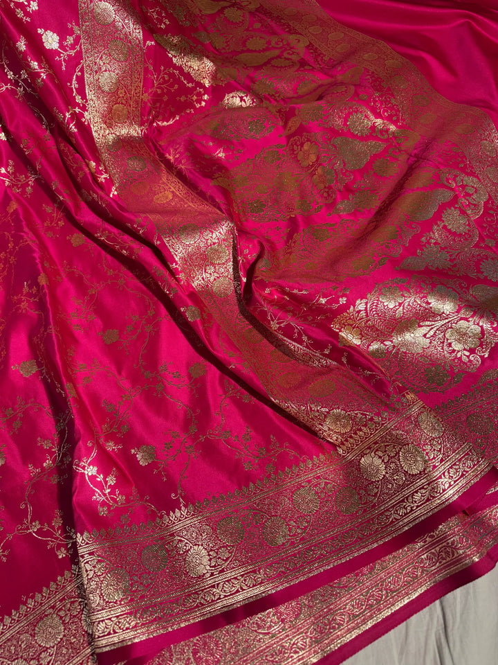 Rani shade satin silk saree with rich texture design and classical pallu