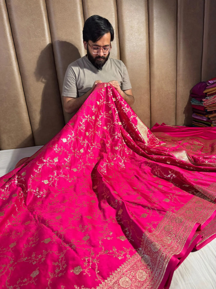 Rani shade satin silk saree with rich texture design and classical pallu