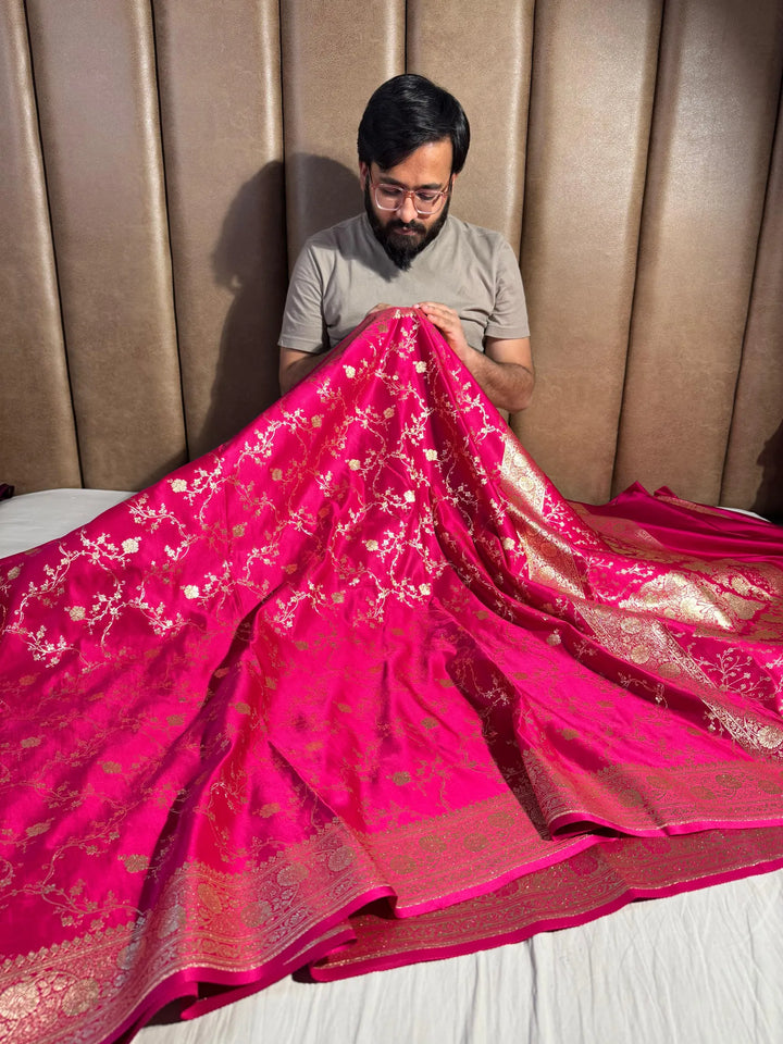 Rani shade satin silk saree with rich texture design and classical pallu