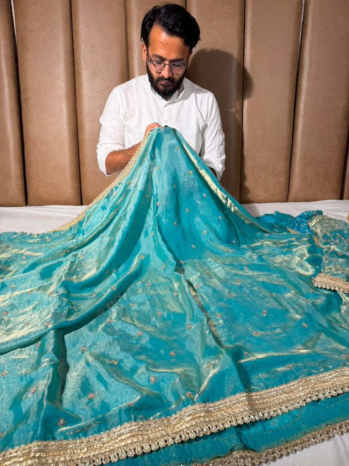 Sea Green Shimmery Tissue Silk Embroidered Lace Work Saree