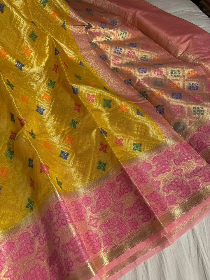 Special yellow tissue organza silk saree with rich pallu and blouse