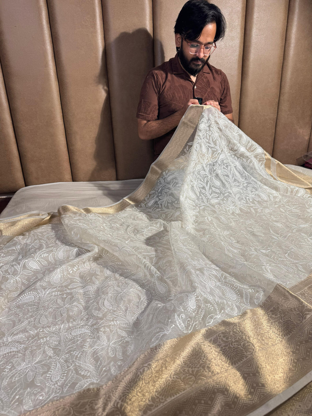Ivory banarasi organza chikankari saree with zari pallu and rich texture border