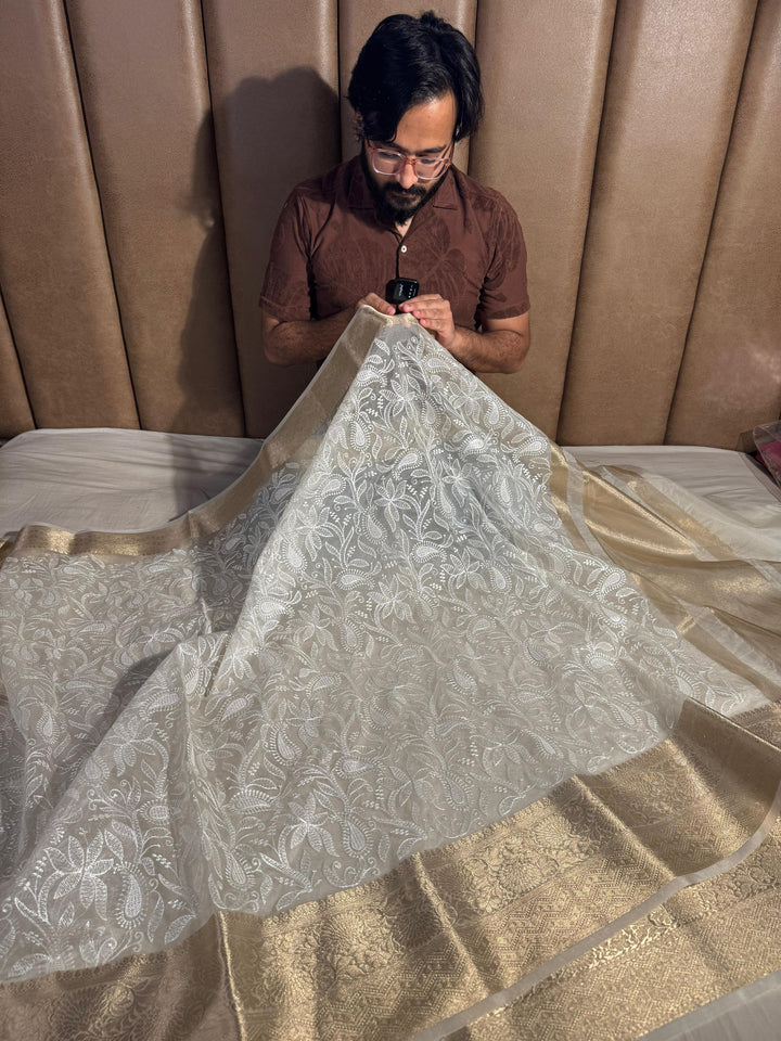Ivory banarasi organza chikankari saree with zari pallu and rich texture border