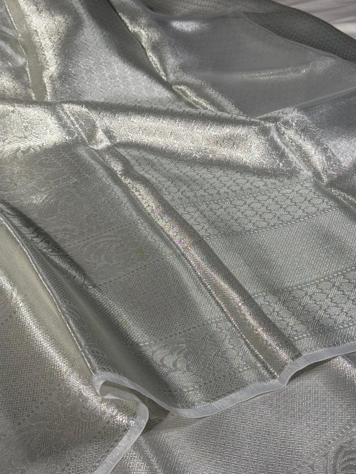 All over silver embossed kanjivaram tissue saree