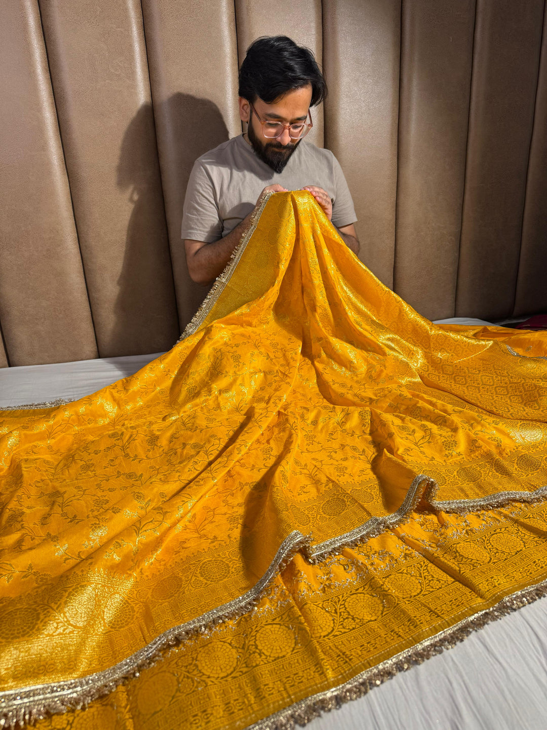 Bright yellow banarasi georgette silk saree with silver meena & lace work