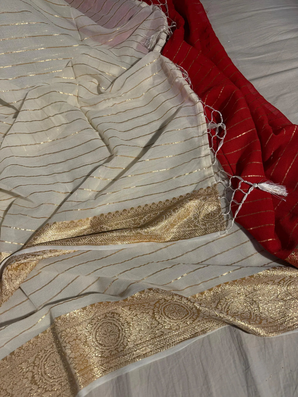 banarasi georgette silk saree with contarst rich blouse and tassel pallu 