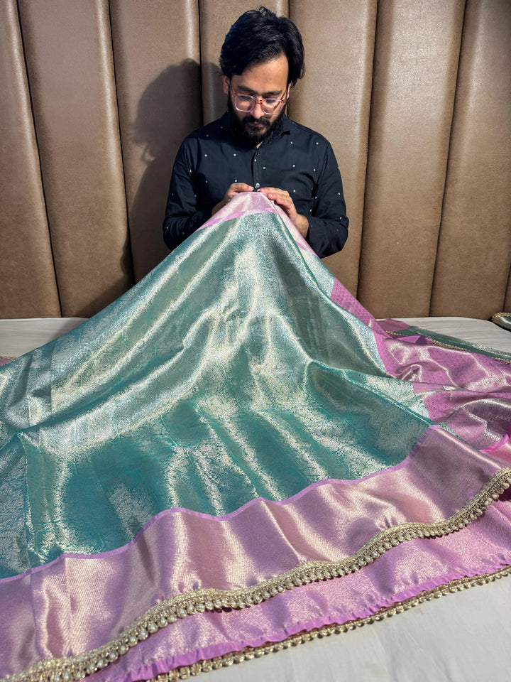 premium powder blue shade water zari tissue silk saree with luxurious lace work