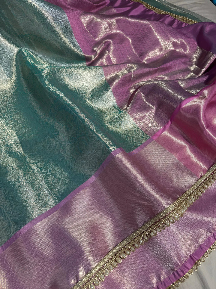 premium powder blue shade water zari tissue silk saree with luxurious lace work