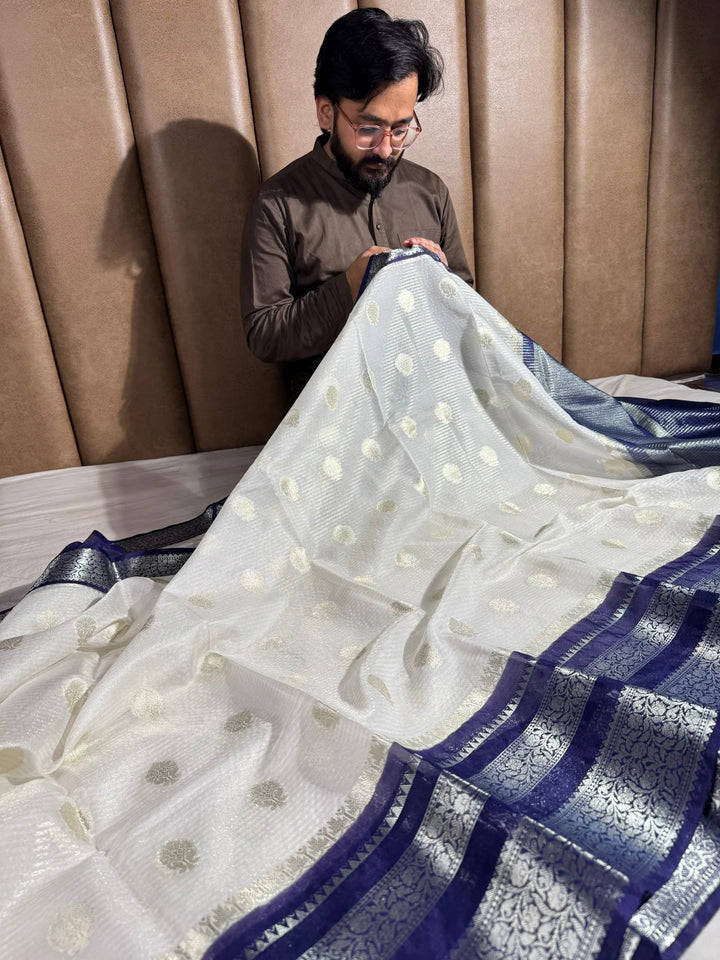 summer friendly cream with contrast rich border and pallu 