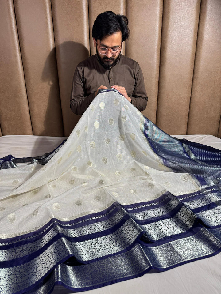 summer friendly cream with contrast rich border and pallu 