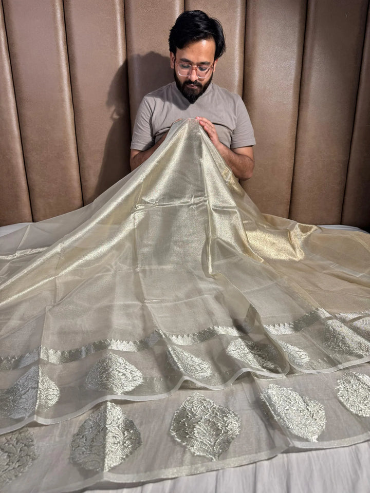 water tone tissue silk saree with rich zari pallu and exclusive border 